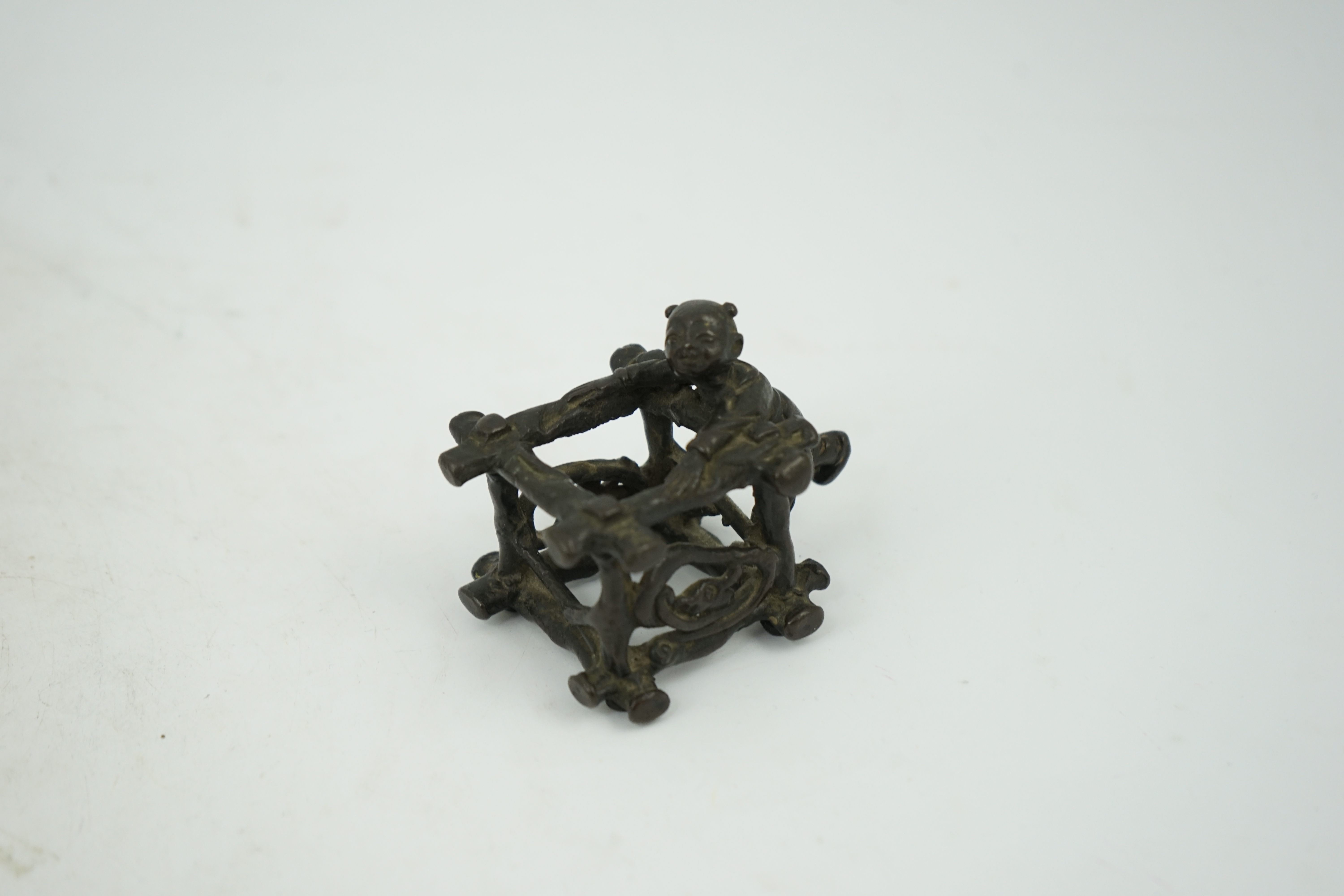 A Chinese bronze figural scroll weight, late Ming